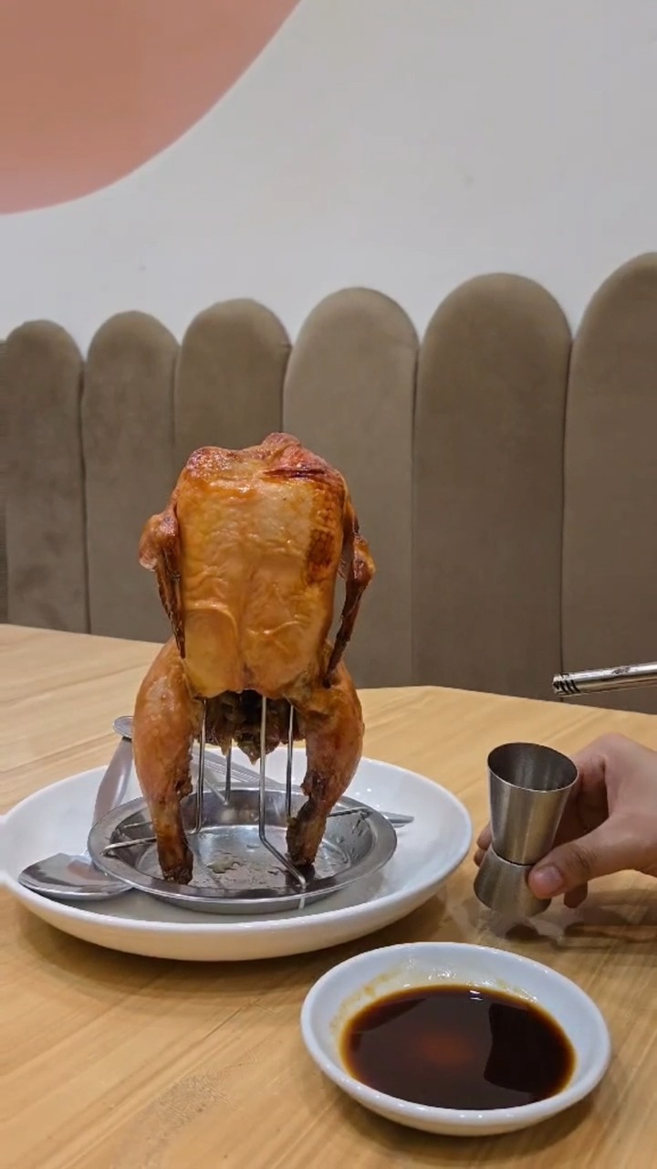 Huang's Flambe Chicken — whole roast chicken on a stand